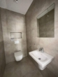 Gäste-WC - Stilvolle KfW 40 EE Neubau EG-Wohnung Nr. 1 im Zentrum von Ostrhauderfehn! mit Stellplatz und Terrasse